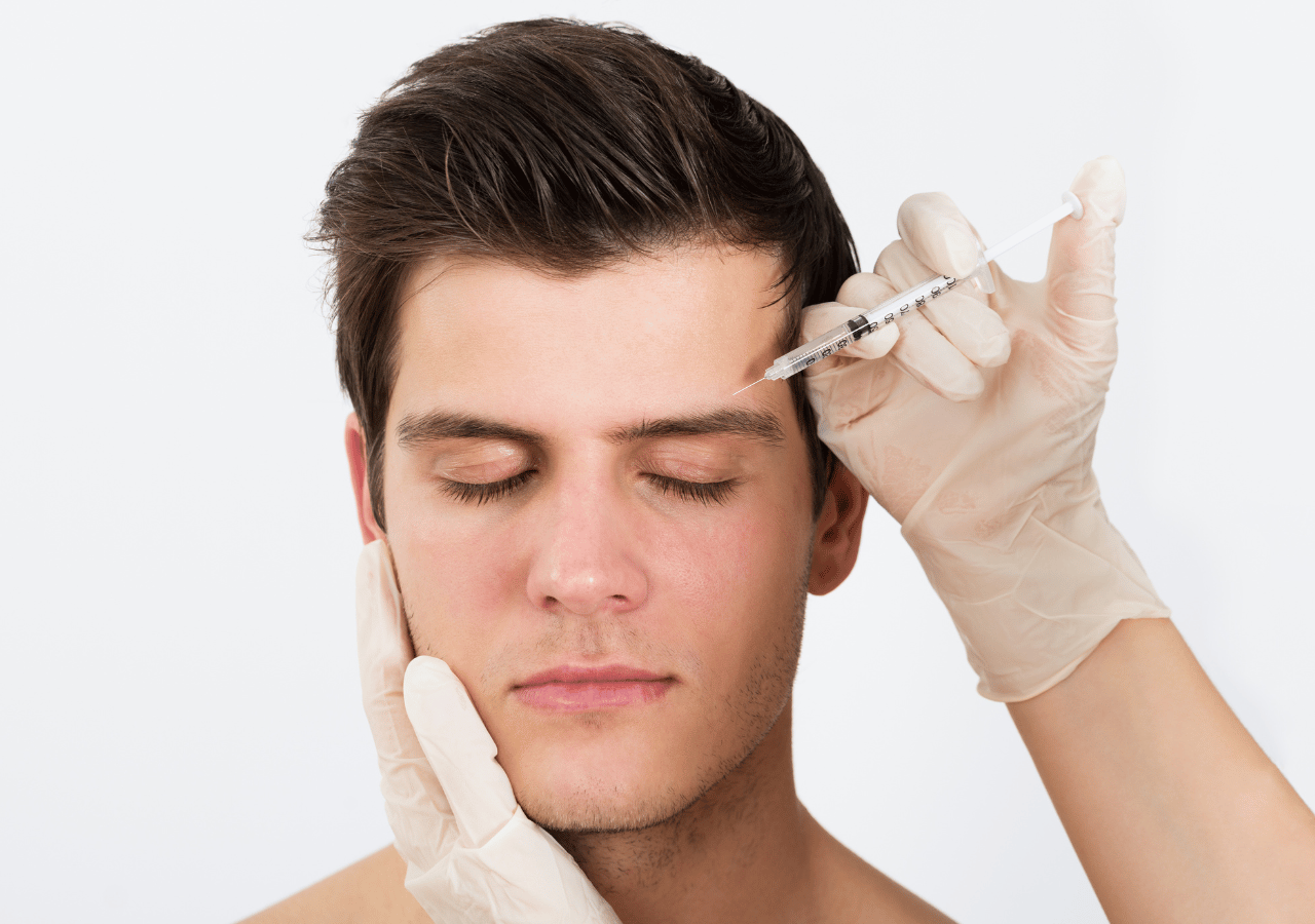 Person Hands Injecting Syringe With Botox