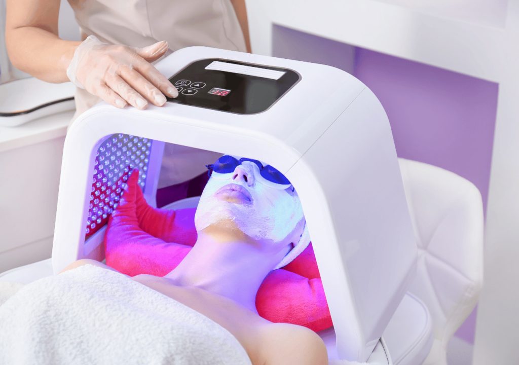 A woman has a Skin Rejuvenation treatment using a phototherapy machine.