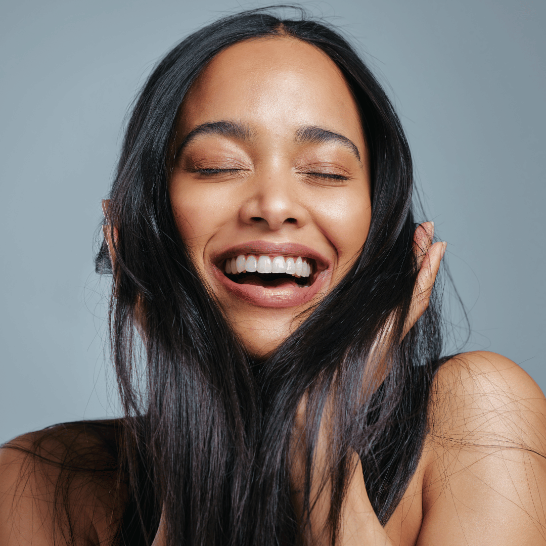 woman happy with her hair after exosomes therapy