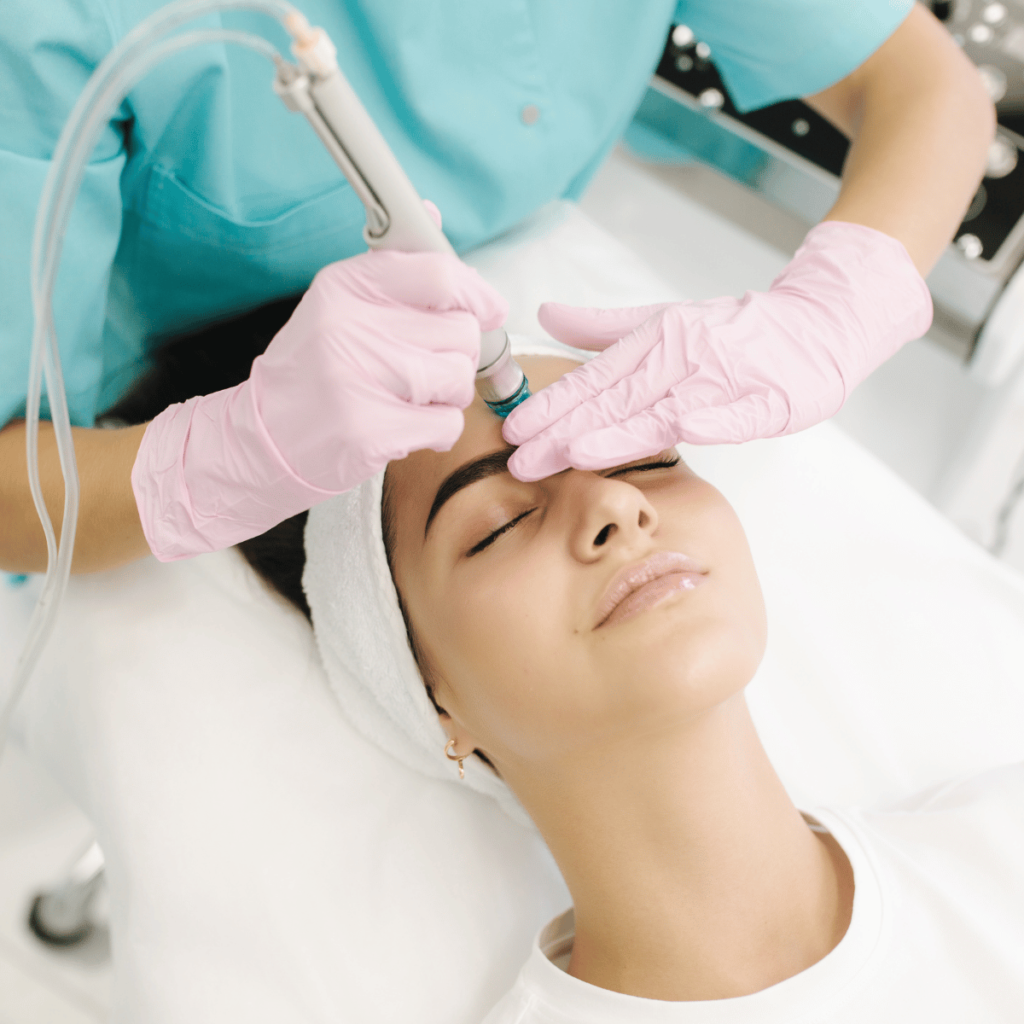 Professional female cosmetologist doing hydrafacial procedure